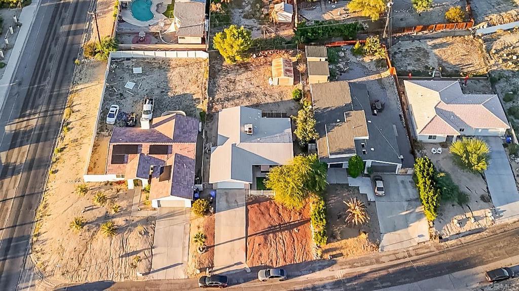 10981 Santa Cruz Road Desert Hot Springs, CA 92240 - Photo 40 of 43 an aerial view of residential houses with outdoor space