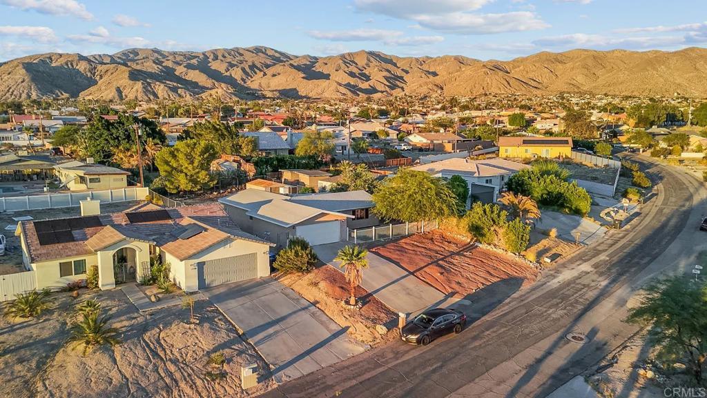 10981 Santa Cruz Road Desert Hot Springs, CA 92240 - Photo 41 of 43 an aerial view of residential houses with outdoor space