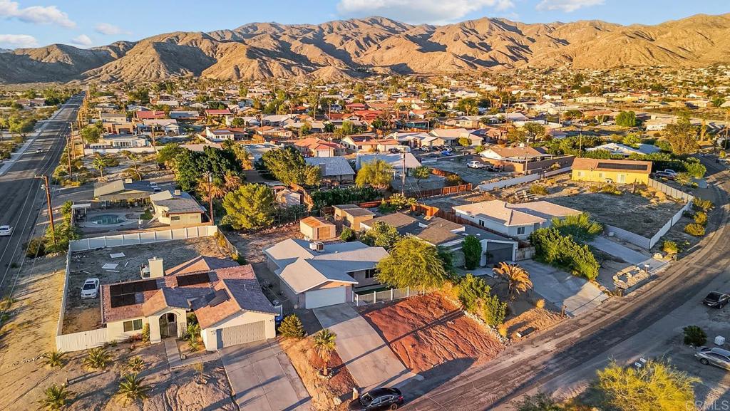 10981 Santa Cruz Road Desert Hot Springs, CA 92240 - Photo 42 of 43 an aerial view of residential houses with outdoor space