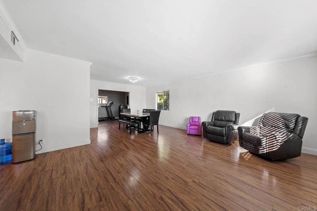10981 Santa Cruz Road Desert Hot Springs, CA 92240 - Photo 6 of 43 a living room with furniture and wooden floor