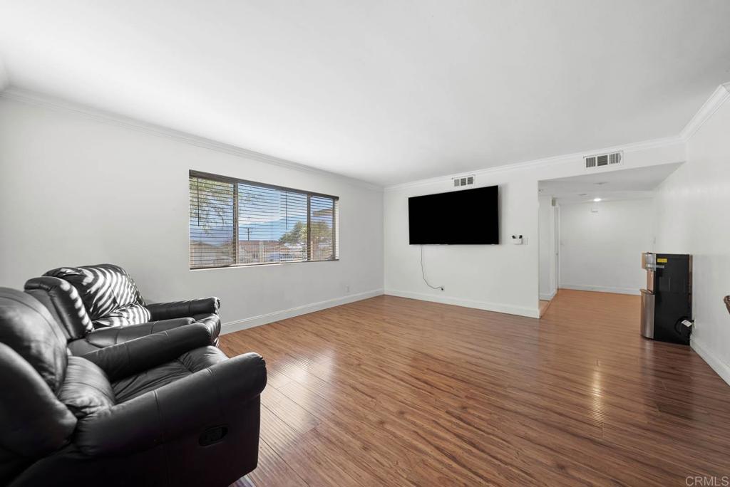10981 Santa Cruz Road Desert Hot Springs, CA 92240 - Photo 8 of 43 a living room with furniture and a flat screen tv