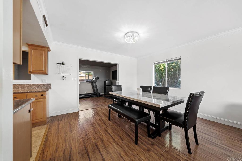 10981 Santa Cruz Road Desert Hot Springs, CA 92240 - Photo 10 of 43 a dining room with furniture and wooden floor