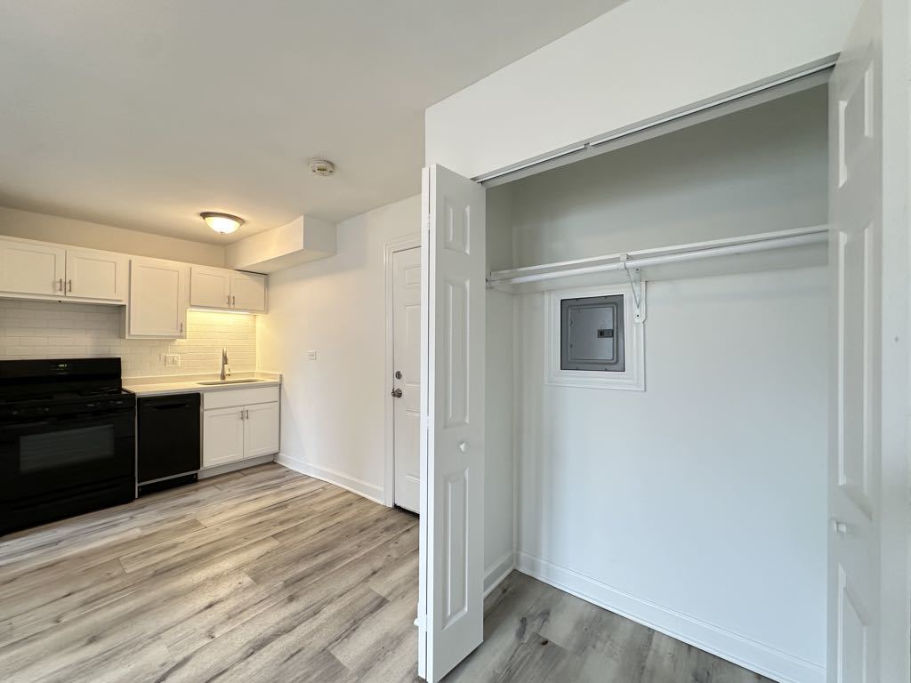 5710 North Winthrop Avenue, Unit G7 Chicago, IL 60660 - Photo 16 of 20 a large white kitchen with a refrigerator and a stove top oven