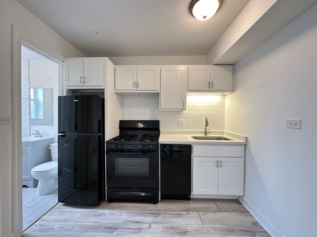 5710 North Winthrop Avenue, Unit G7 Chicago, IL 60660 - Photo 3 of 20 a kitchen with a sink and a refrigerator