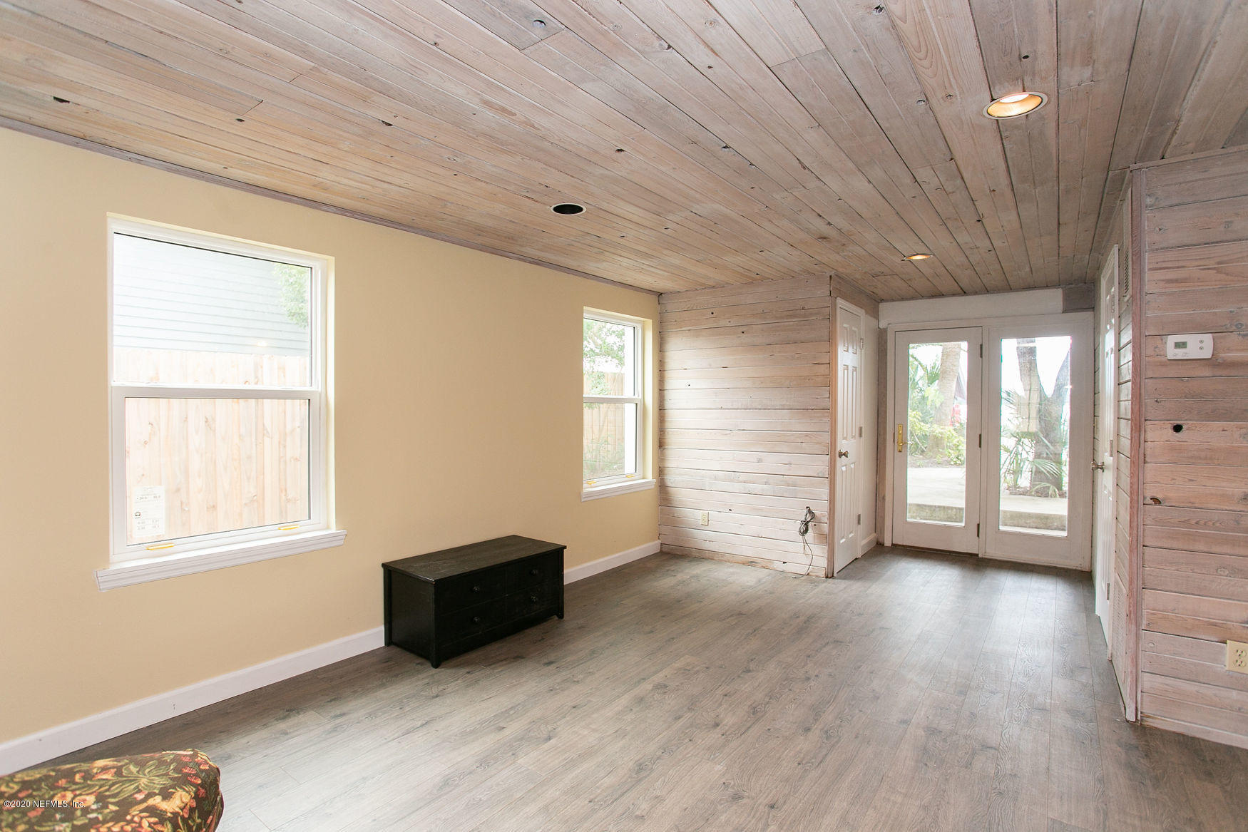 6317 Salado Road St. Augustine, FL 32080 - Photo 13 of 51 a view of an empty room with wooden floor and a window