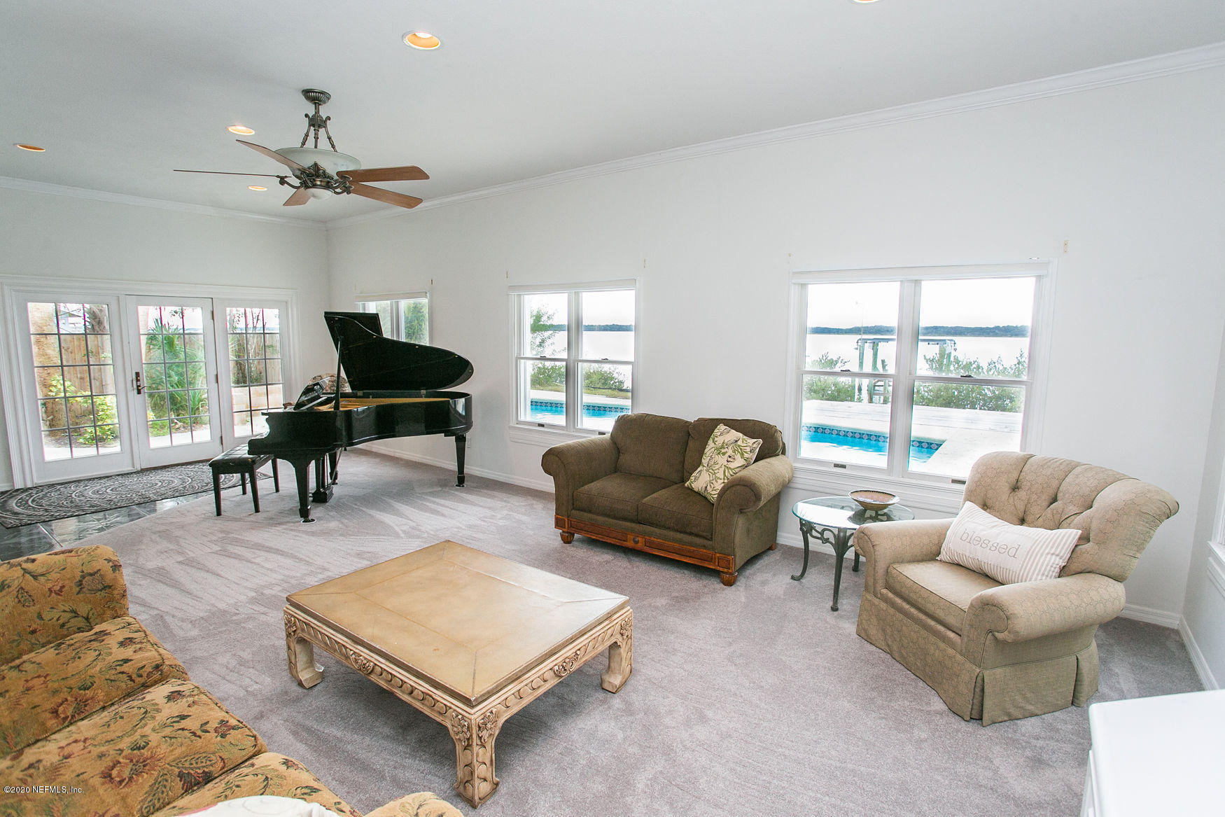6317 Salado Road St. Augustine, FL 32080 - Photo 21 of 51 a living room with furniture and a large window