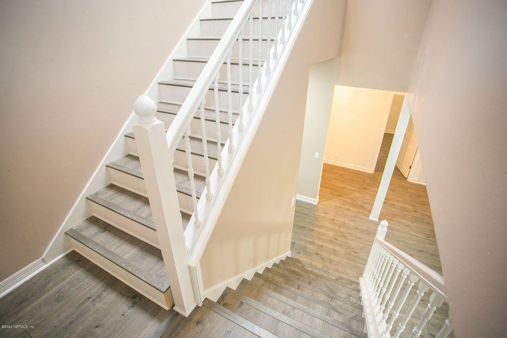 6317 Salado Road St. Augustine, FL 32080 - Photo 22 of 51 a view of staircase with white walls and a window