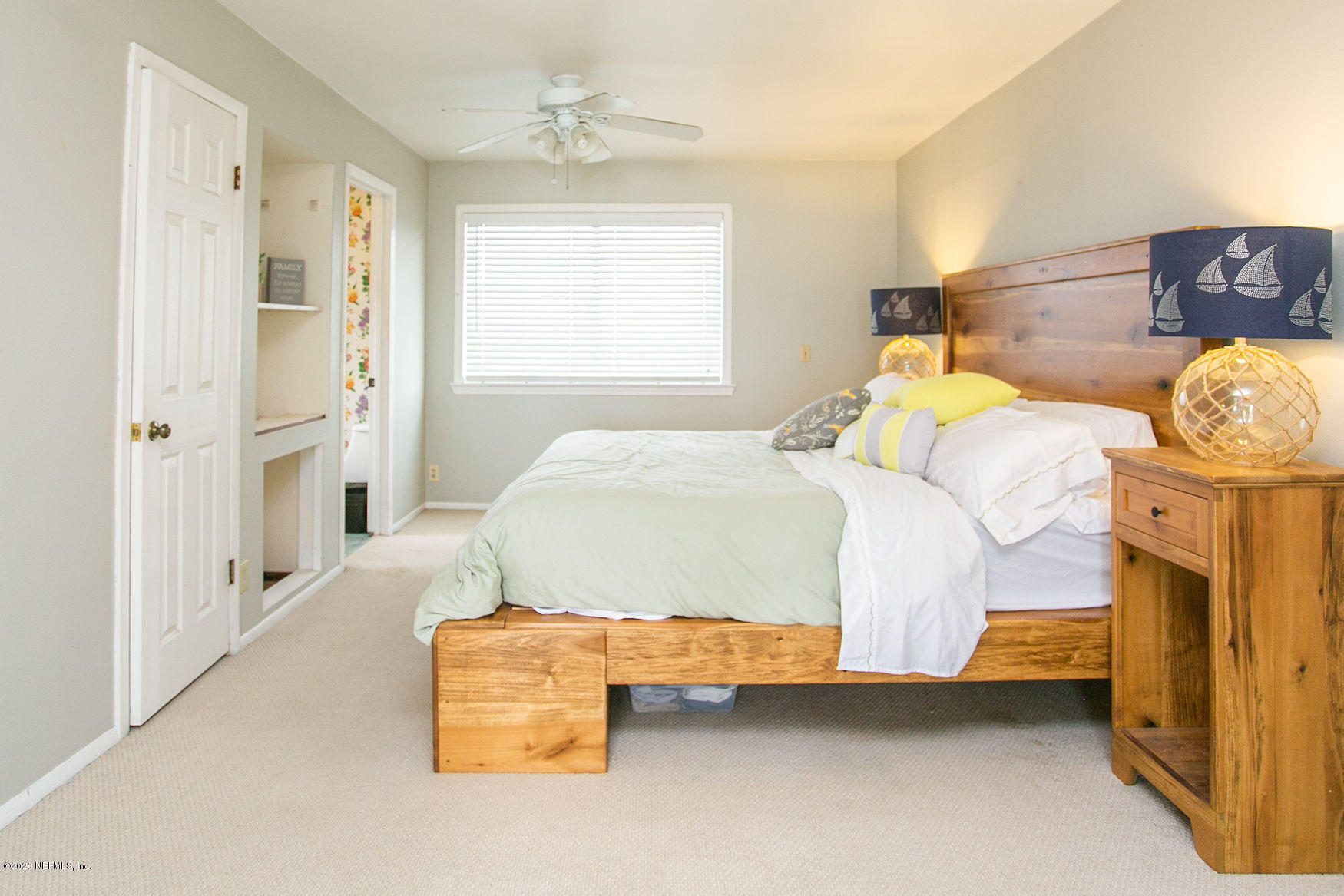 6317 Salado Road St. Augustine, FL 32080 - Photo 25 of 51 a bedroom with a bed and a window