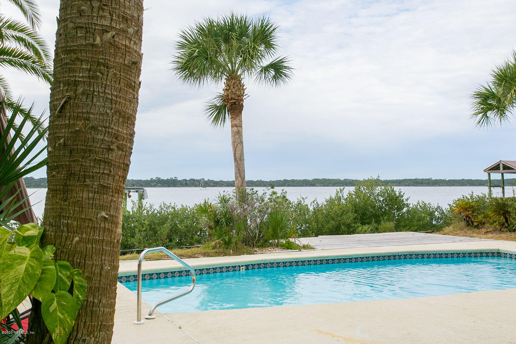 6317 Salado Road St. Augustine, FL 32080 - Photo 3 of 51 a view of a swimming pool with a lake view