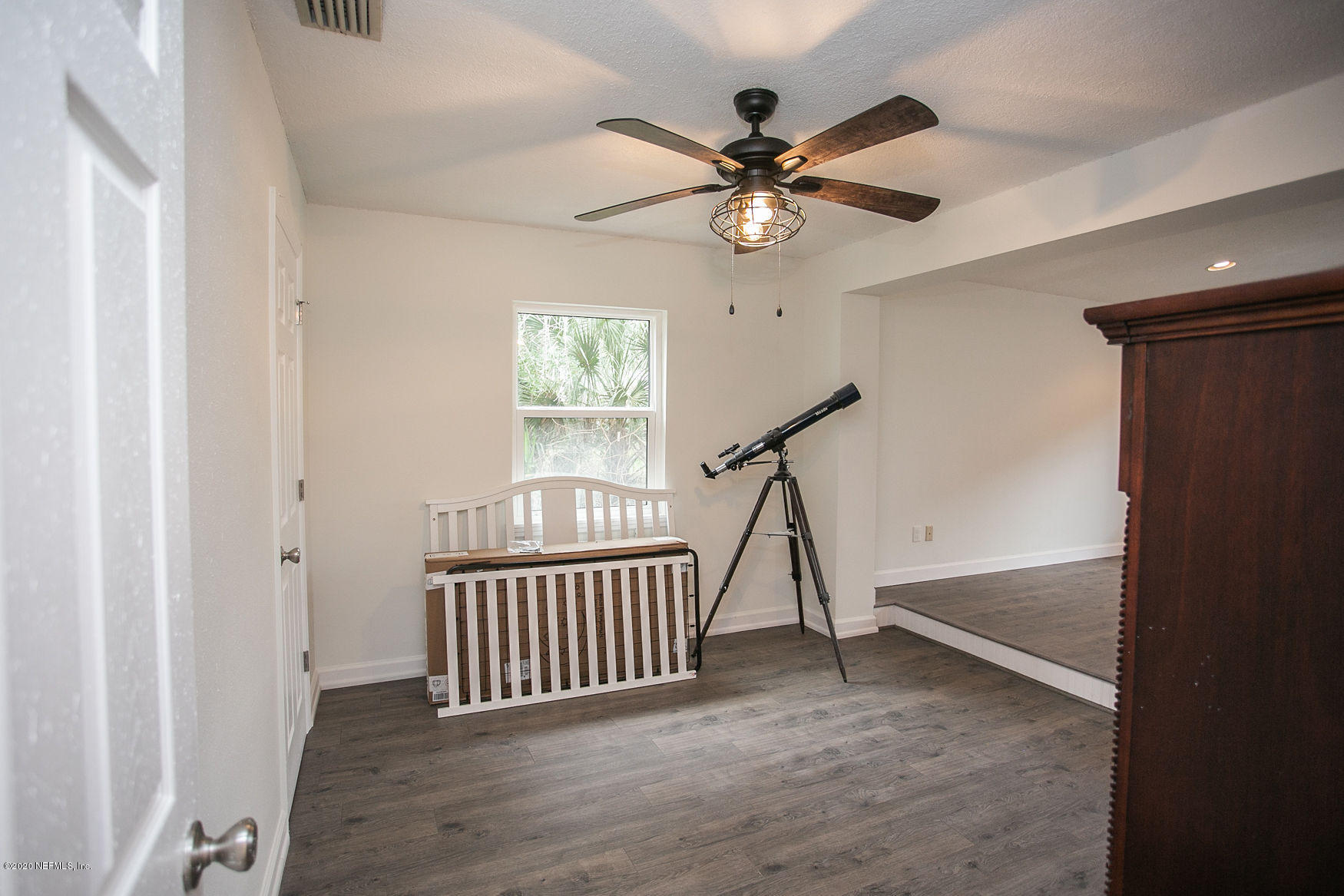6317 Salado Road St. Augustine, FL 32080 - Photo 36 of 51 a view of a livingroom with a hardwood floor and a ceiling fan