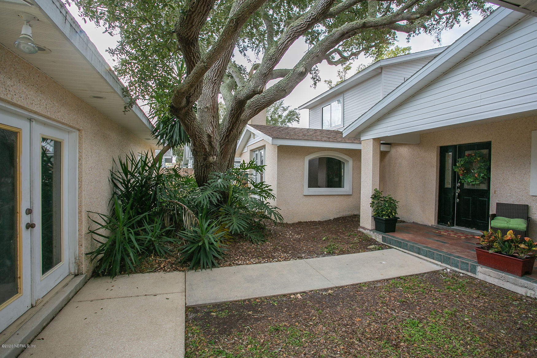 6317 Salado Road St. Augustine, FL 32080 - Photo 6 of 51 a front view of a house with garden