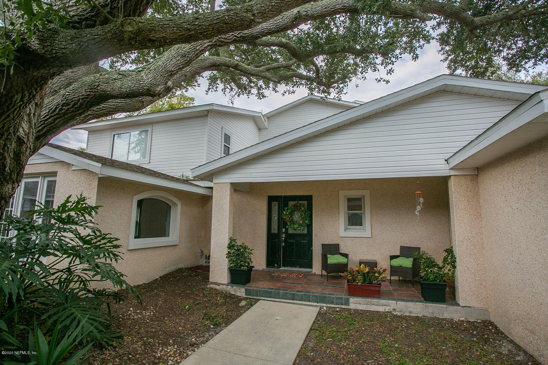 6317 Salado Road St. Augustine, FL 32080 - Photo 7 of 51 a front view of a house with garden