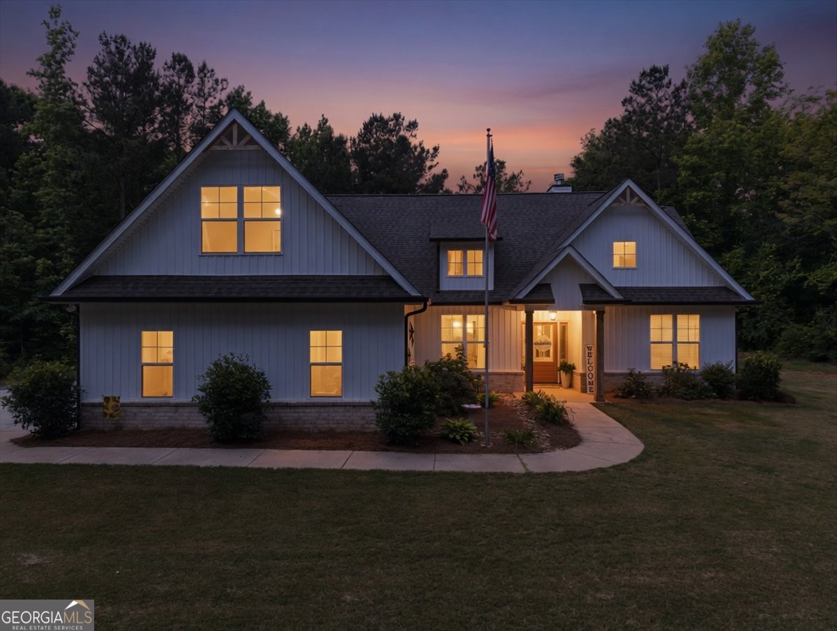 683 Teagle Road Forsyth, GA 31029 - Photo 3 of 50 a front view of a house with garden
