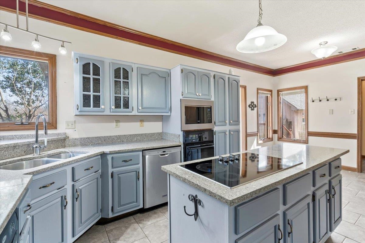 4590 Whiteoaks Lane Bartlett, TN 38002 - Photo 20 of 40 a kitchen with granite countertop a sink and stove