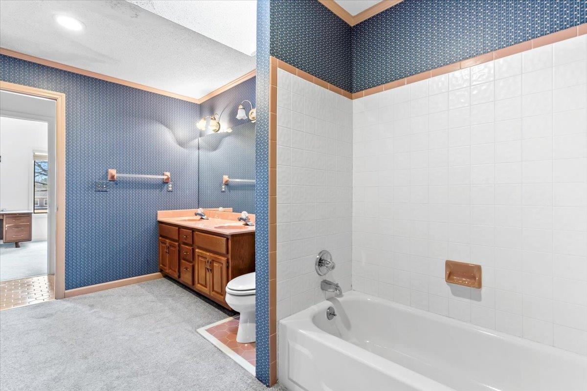 4590 Whiteoaks Lane Bartlett, TN 38002 - Photo 27 of 40 a bathroom with a tub sink and mirror