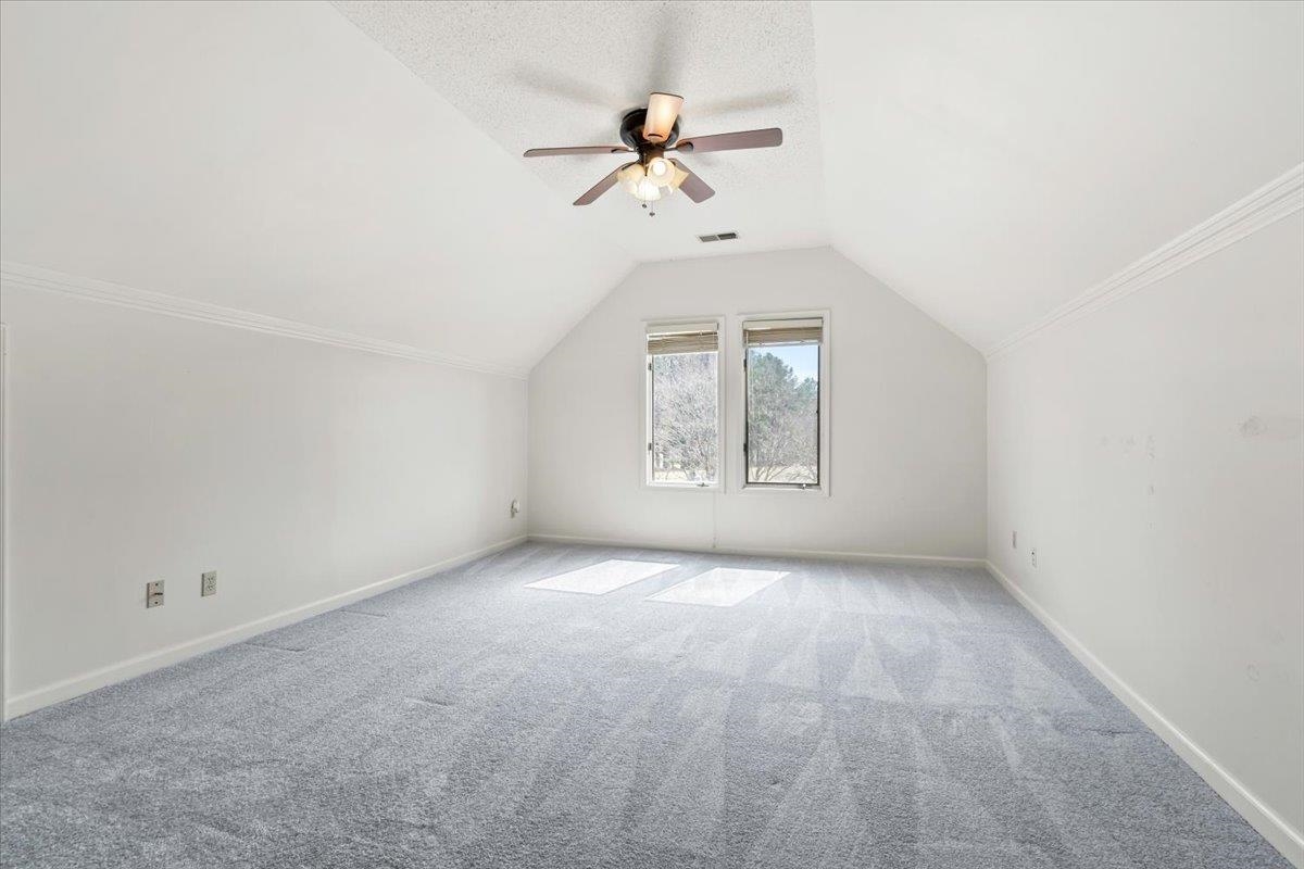 4590 Whiteoaks Lane Bartlett, TN 38002 - Photo 29 of 40 an empty room with a ceiling fan and window