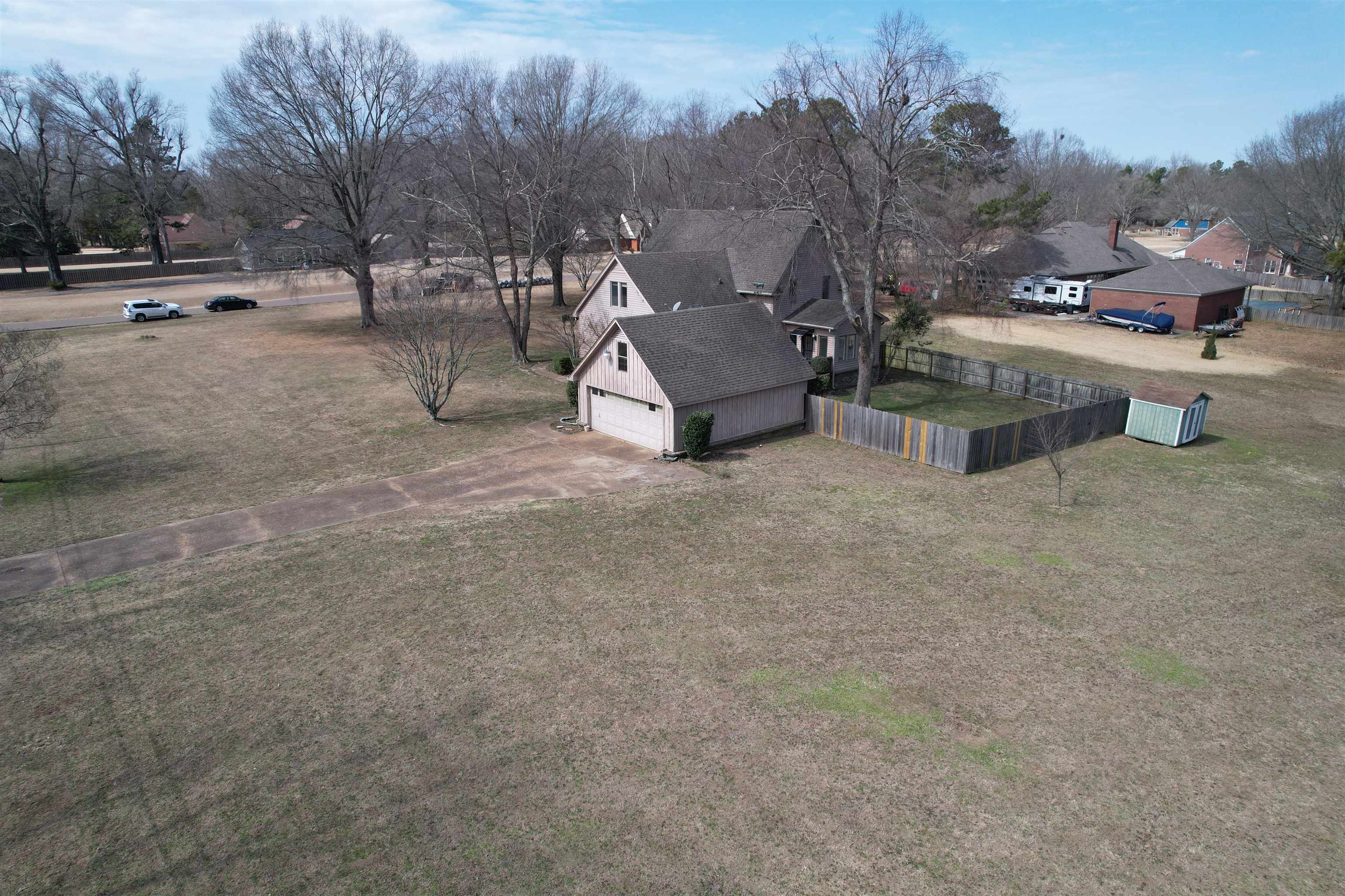 4590 Whiteoaks Lane Bartlett, TN 38002 - Photo 4 of 40 a view of a fire pit with a bench in the middle