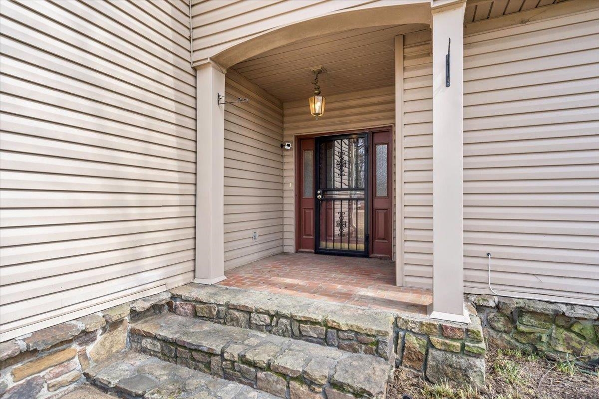 4590 Whiteoaks Lane Bartlett, TN 38002 - Photo 9 of 40 a view of a house with wooden door