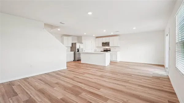 a view of kitchen with wooden floor