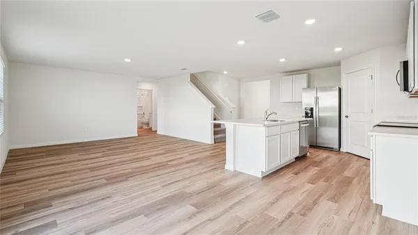 a view of kitchen with wooden floor