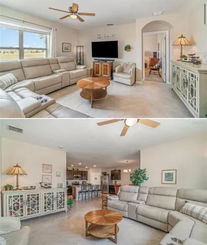 a living room with furniture kitchen view and a flat screen tv