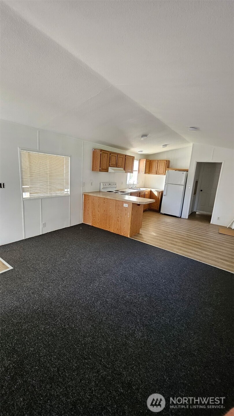 5705 Littlerock Road Southwest, Unit 32 Tumwater, WA 98512 - Photo 3 of 6 a view of a room with workspace and a window
