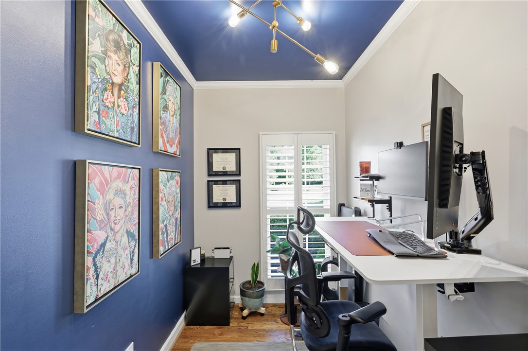 103 5 Knoll Court Anderson, SC 29621 - Photo 12 of 33 A well-lit study with hardwood flooring and a unique blue ceiling, perfect for focused work.