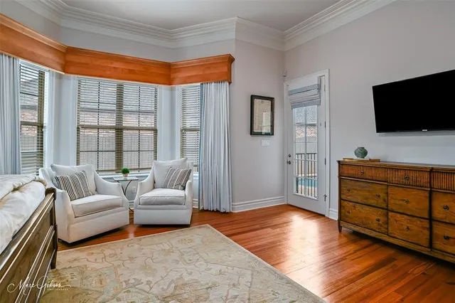 a bedroom with a bed and glass window