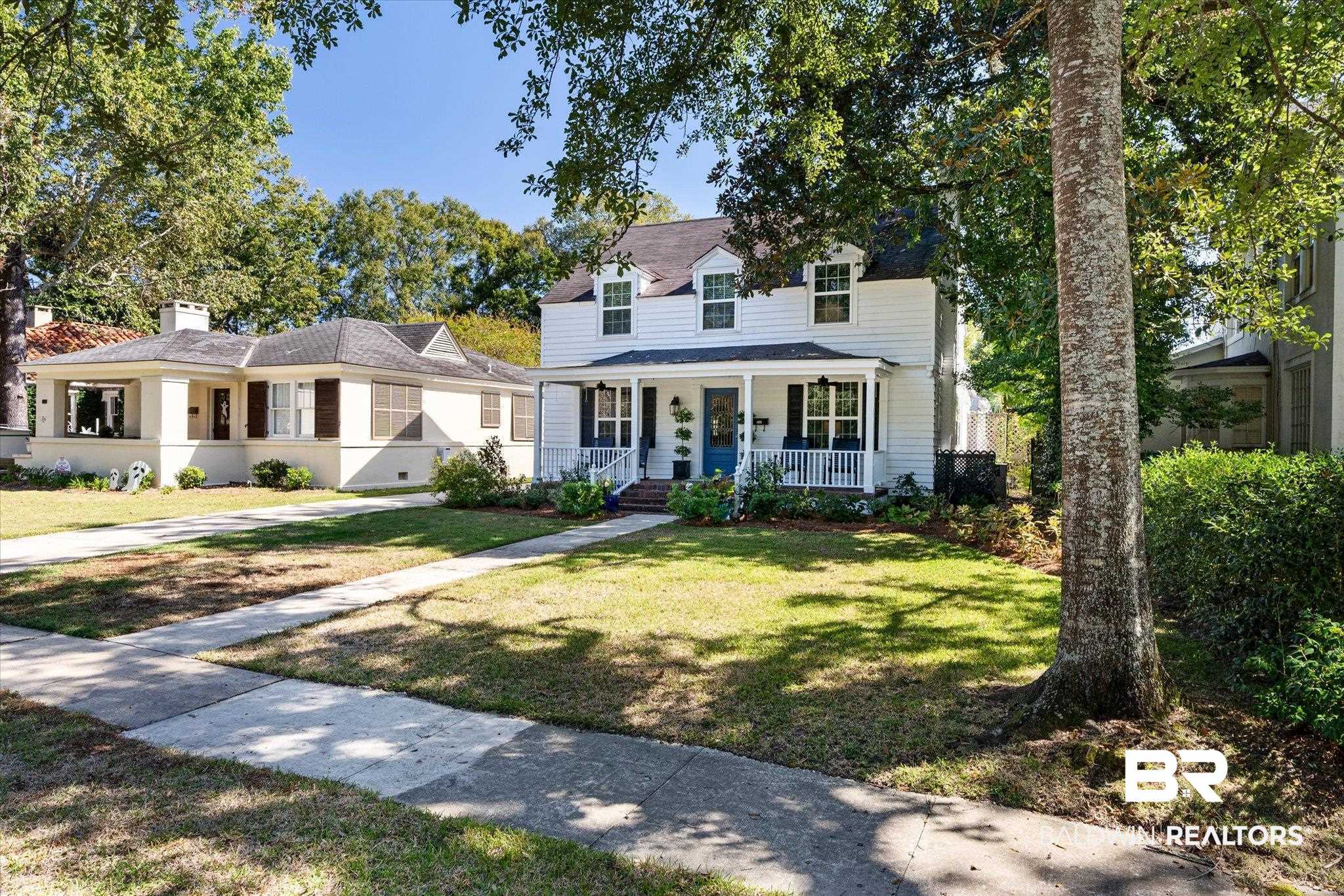 202 Woodlands Avenue Mobile, AL 36607 - Photo 41 of 53 View of front of home featuring covered porch and a front yard
