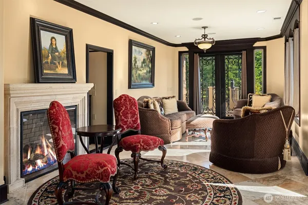 a living room with furniture fireplace and flat screen tv