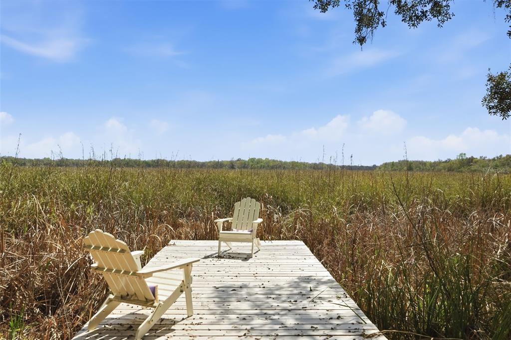 7570 East Ringer Court Inverness, FL 34453 - Photo 28 of 43 a view of a lake with a mountain view