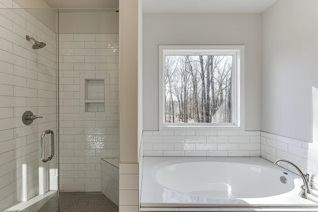 a bathroom with double sink and a mirror