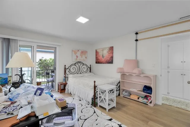 a bathroom with a shower sink vanity mirror and toilet