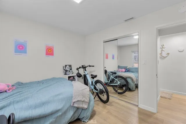 a bedroom with a bed and a desk