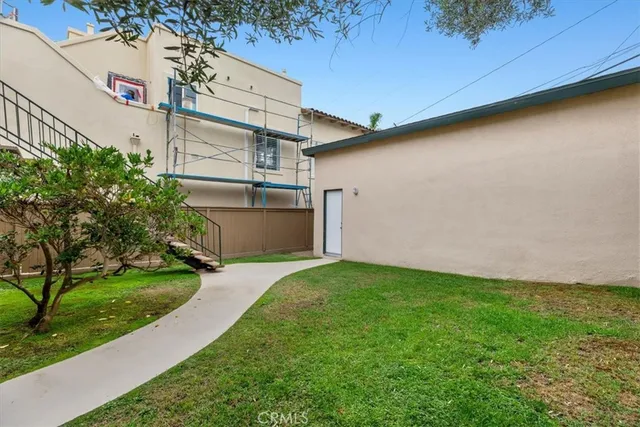 a view of a house with a yard porch and sitting area