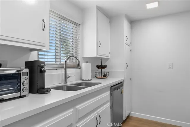a view of a dining room with furniture and window