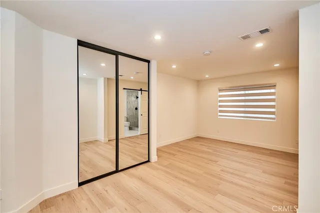 a view of entryway with wooden floor