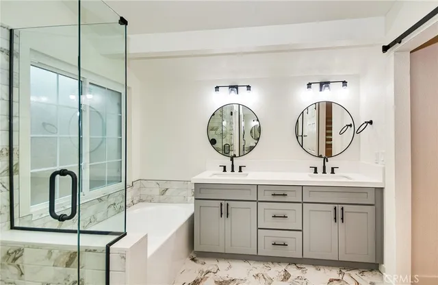a bathroom with 2 sink and a mirror