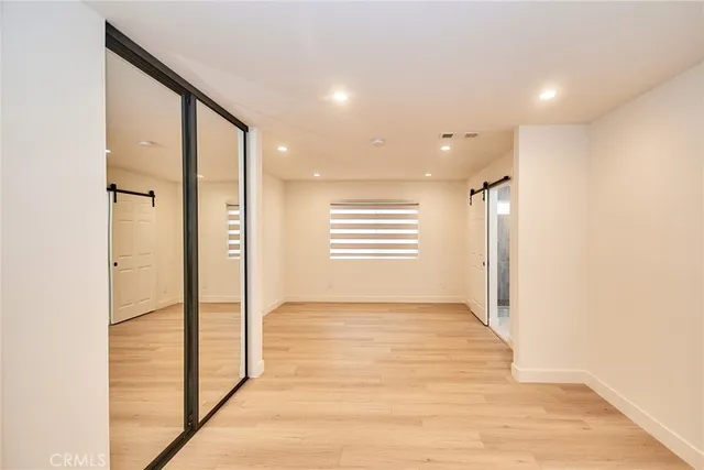 a view of hallway with a large window