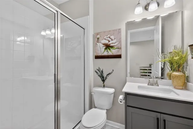 a living room with furniture and a ceiling fan