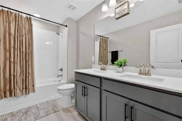 a bedroom with a bed and a book shelf