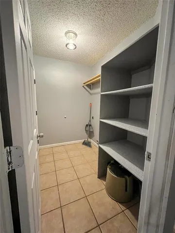 a view of an empty room with a fireplace