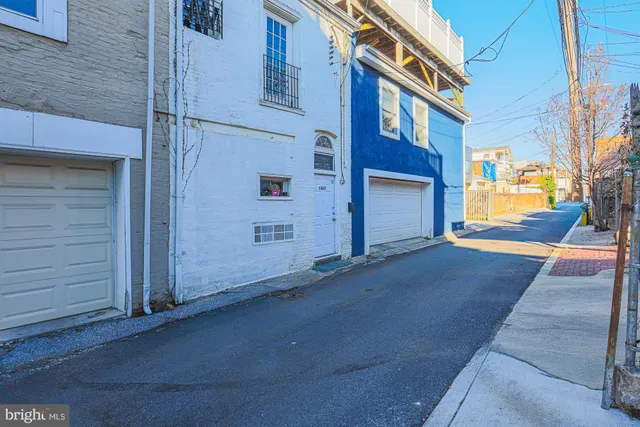 a living room with a rug and a stove