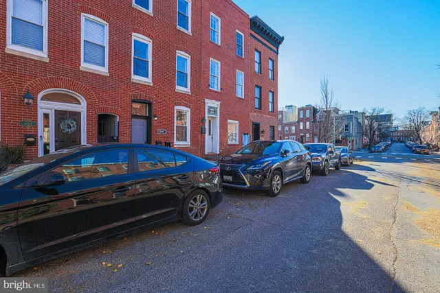 a front view of a house with parking space
