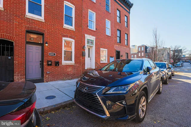 a front view of a building with outdoor seating
