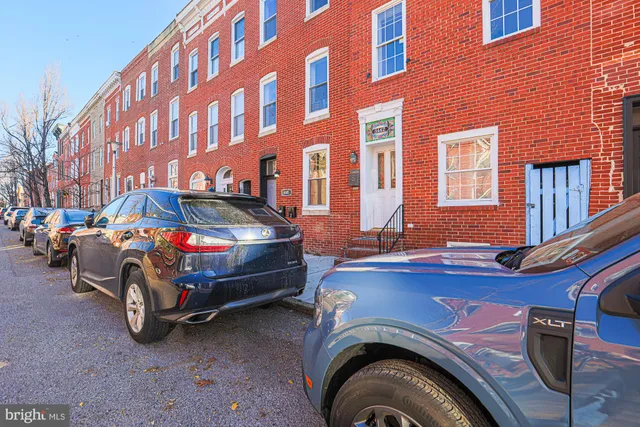a front view of a house with parking space