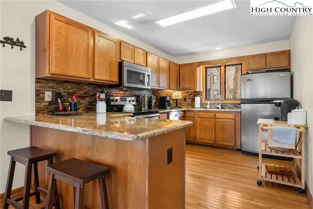 a kitchen with a sink cabinets and window