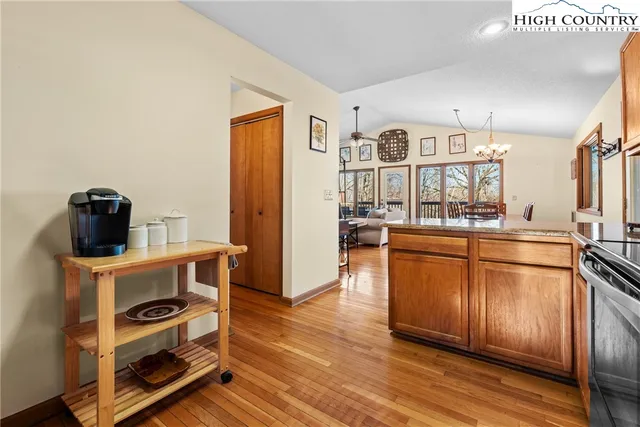 a kitchen with stainless steel appliances a stove a sink and a refrigerator