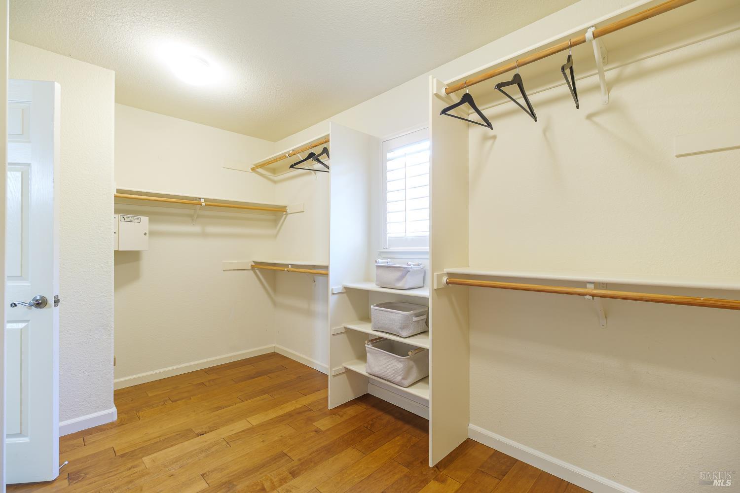 68 Pinheiro Circle Novato, CA 94945 - Photo 52 of 82 Expansive walk-in closet in primary: the oversized walk-in closet offers exceptional storage with generous hanging space, built-in shelving, and room to keep your wardrobe beautifully organized.