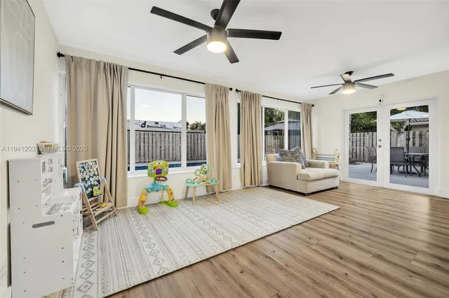 a living room with furniture fireplace and flat screen tv